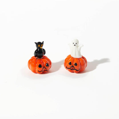 Halloween glass pumpkin ornaments featuring owl and ghost designs, perfect for elegant and whimsical seasonal décor.